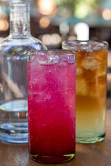 refreshing drinks in a restaurant setting, prickly pear and Arnold Palmer drinks, shallow depth of field