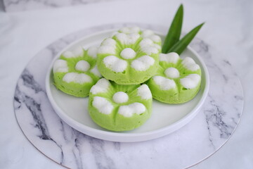 Kue Putu Ayu, a traditional Indonesian snack made from rice flour, pandan leaves, grated coconut then steamed.