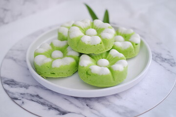 Kue Putu Ayu, a traditional Indonesian snack made from rice flour, pandan leaves, grated coconut then steamed.