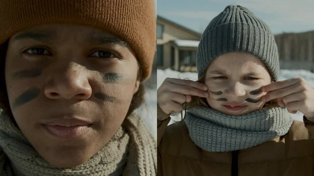 Split screen close-up vertical portrait shot of teenage African American girl and young Caucasian boy in winter hat, scarf and jacket painting war stripes on face before snowball fight in yard