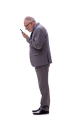 Obraz premium Old businessman talking by phone isolated on white