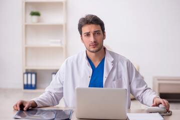 Young male doctor radiologist working in the clinic