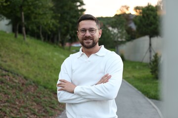 Fototapeta premium Portrait of handsome bearded man in glasses outdoors