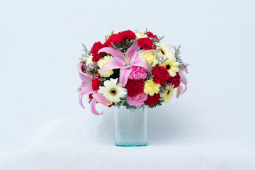Gifts made from flowers in a vase or basket.