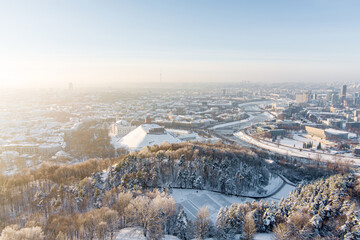 Beautiful sunny Vilnius city scene in winter. Aerial early evening view. Winter city scenery in Lithuania.