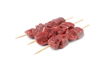Wooden skewers with cut fresh beef meat isolated on white