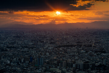 Tokyo city view with sun at sunset time.