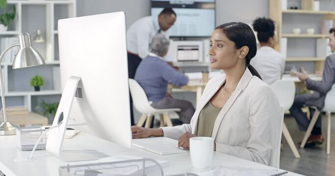Thinking, reading and business woman with computer in office for good news, email or positive feedback. Smile, success and Indian female designer online with design inspiration, idea or goal victory