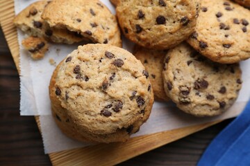 Delicious chocolate chip cookies on table, flat lay