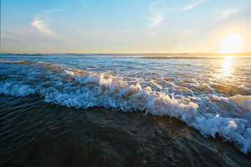 Atlantic ocean sunset with surging waves at Fonte da Telha beach, Costa da Caparica, Portugal - 664698709