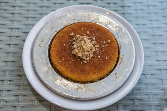 Turkish kunefe topped with walnut.