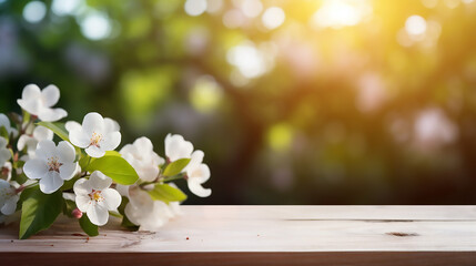 beautiful spring background with white blossoms and white wooden table and bokeh background