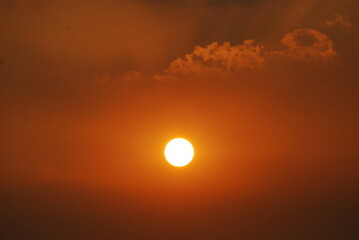 Scenic view dramatic beautiful sunset sky. Natural Sunset Sunrise on meadow silhouette shadow dark land. Vibrant dramatic sky on sunset, dawn, sunrise in Countryside. Landscape Colorful Sky At Sunset