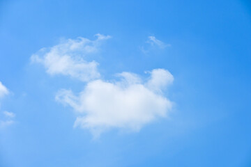 Fototapeta premium beautiful blue sky and white fluffy group of clouds with sunrise in the morning, natural background