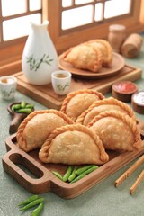 Jalangkote  is a South Sulawesi fried dumpling from Indonesian cuisine, stuffed with rice vermicelli, vegetables, potatoes and eggs. Spicy, sweet and sour sauce will be dipped into prior to be eaten. 