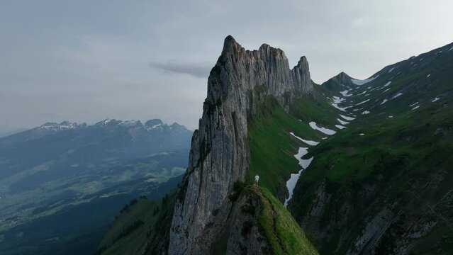 Drone footage of hikers on Saxer Lucke Viewpoint overlooking the Altmann Mountain, Switzerland