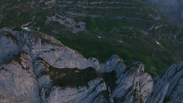Drone footage over the peak of Altmann Mountain on the Alpstein Appenzell at sunrise, Switzerland