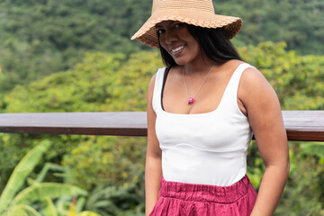 Latin Woman traveler standing smiling and looking at camera