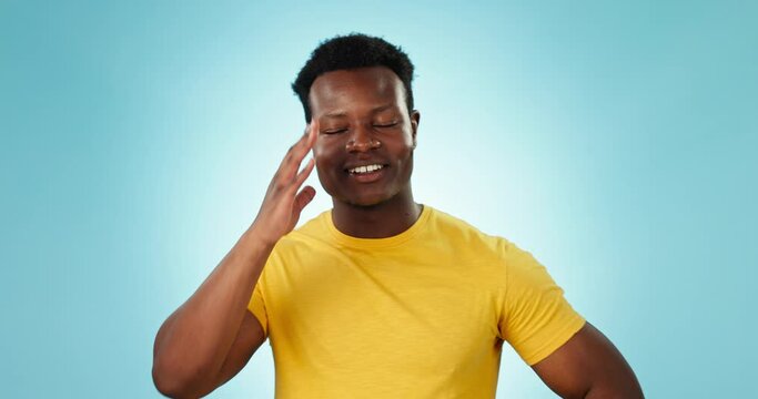 Facepalm, oops and embarrassed black man in studio for silly, mistake or fake news on blue background. Dumb, face and African guy model with stupid emoji for memory, forget or goofy regret expression