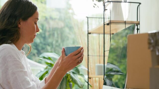 Woman On Coffee Break Running Online Business From Home Working At Computer - Shot In Slow Motion