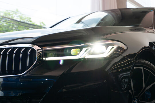 BMW 5 Series, 530e headlight focused shot, close up view - High Resolution Image