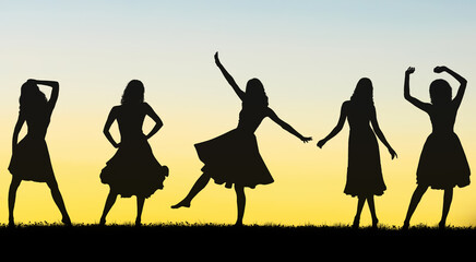 Silhouettes of carefree girls have a spirited and carefree time - 664735368
