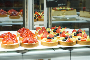 Cake and pastries on display at a bakery.