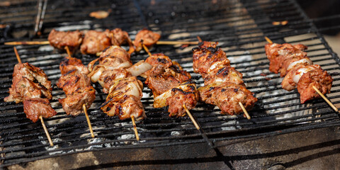 Roasted meet during cooking on mesh