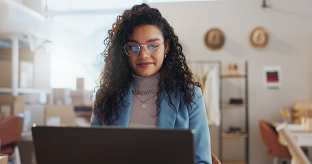 Woman, fashion designer and laptop in small business management, logistics or research at boutique....