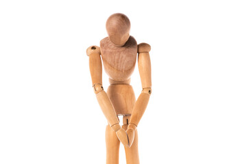 A wooden mannequin standing on a white surface. Ideal for showcasing clothing or accessories in a...