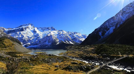 Panoramic view with mountain view of  alpine as snow-capped mount peaks in  Autumn scene mountains