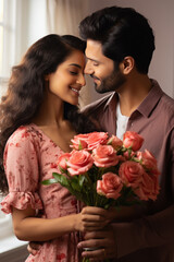 Young man giving flower bouquet to her wife or girlfriend.