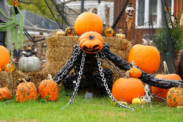 Scary Halloween decorations sit outside for the holiday.