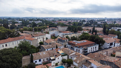 Aerial view over Montpellier. Trees pop out from the old stone buildings