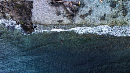 Waves hitting rocky beach