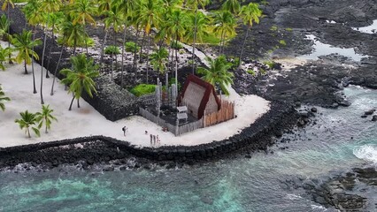 Aerial historic grass house Honaunau bay lava Kona Hawaii.  O Hōnaunau National Historical Park. Refuge protection. Home to Hawaiian Chiefs. Sacred religious site. Tropical landscape Pacific ocean.