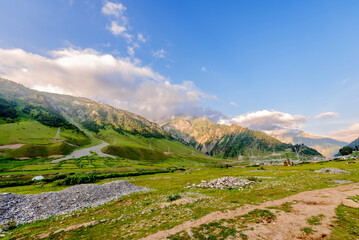 A stunning view of mountain, river, valley, snow, blue sky, white clouds. A serene place at national highway at the Himalayan mountain range