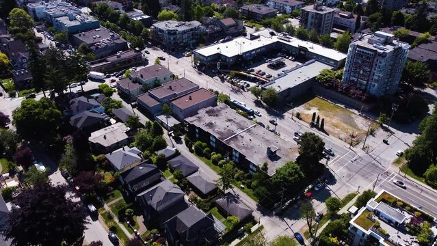 Aerial footage of kitsilano near 4th and Alma St. Flying over homes and other buildings