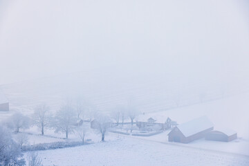 Foggy winter day in the countryside from above