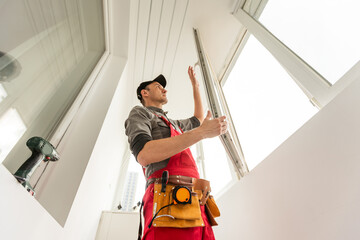 Professional master at repair and installation of windows, changes rubber seal gasket in pvc windows