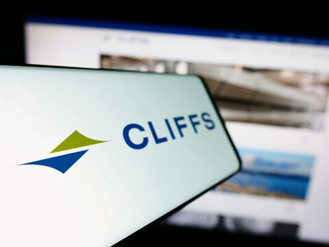 Stuttgart, Germany - 09-25-2023: Mobile phone with logo of American steel company Cleveland-Cliffs Inc. in front of business website. Focus on left of phone display.