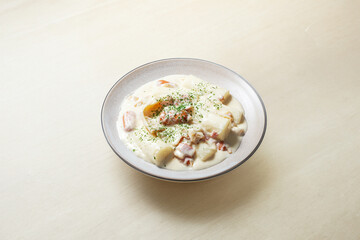 Cream sauce tteokbokki on a plate	