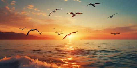 Fototapeten bright wedge of birds flying over the sea © xartproduction