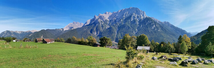 Fototapeta na wymiar Beautiful panorama with Alps. European mountain range. Mountain landscape with beautiful blue sky.