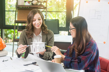 Architectural woman designer making digital building plan for professional construction renovation in office.