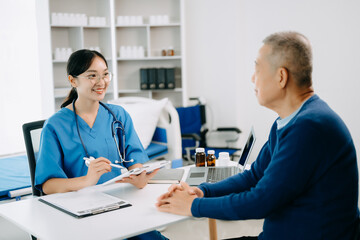 Serious Asia female doctor using clipboard is delivering great news talk discuss results or symptoms with female patient in clinic or hospital .