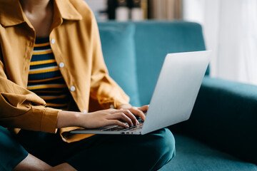 Confident businesswoman working on laptop,tablet and smartphone at her workplace at office..