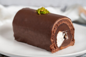 Chocolate cake. Delicious slice of cake on wooden background. patisserie products. Close up