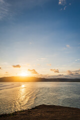 beautiful sunset landscape at tropical beach in Lombok, Indonesia. Bright sunset landscape near Kuta beach area, Lombok, Indonesia