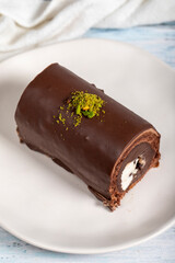 Chocolate cake. Delicious slice of cake on wooden background. patisserie products. Close up